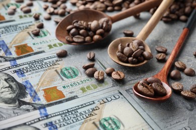 Image of Coffee price rising. Dollars and spoons with roasted coffee beans