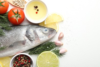 Photo of Fresh raw seabass fish with spices on white table, flat lay and space for text. Seafood delicacies