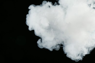 Photo of Beautiful hookah smoke on black background, closeup