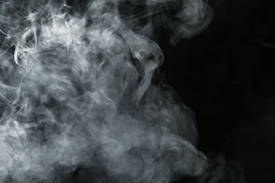 Photo of Hookah smoke on black background, closeup. Space for text
