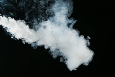 Photo of Beautiful hookah smoke on black background, closeup
