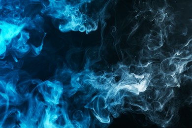 Photo of Beautiful hookah smoke on black background, closeup