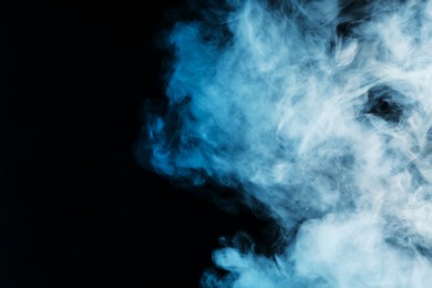 Photo of Hookah smoke on black background, closeup. Space for text