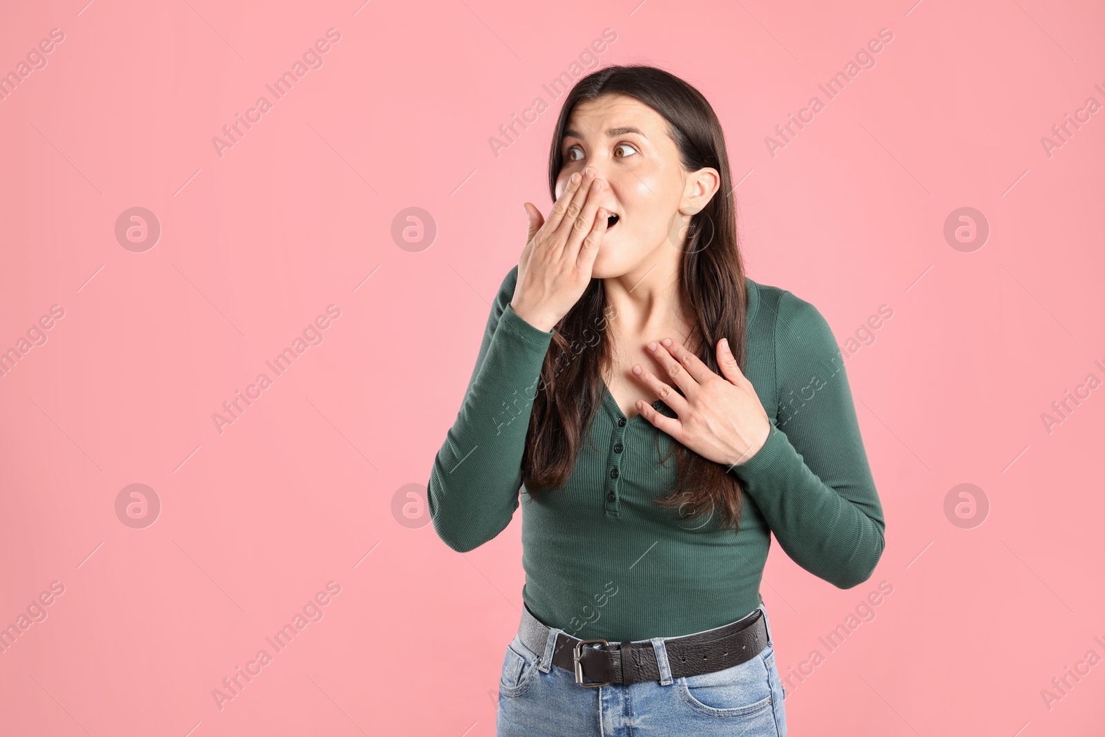 Portrait of surprised woman on pink background, space for text Photo of Portrait of surprised woman on pink background, space for text