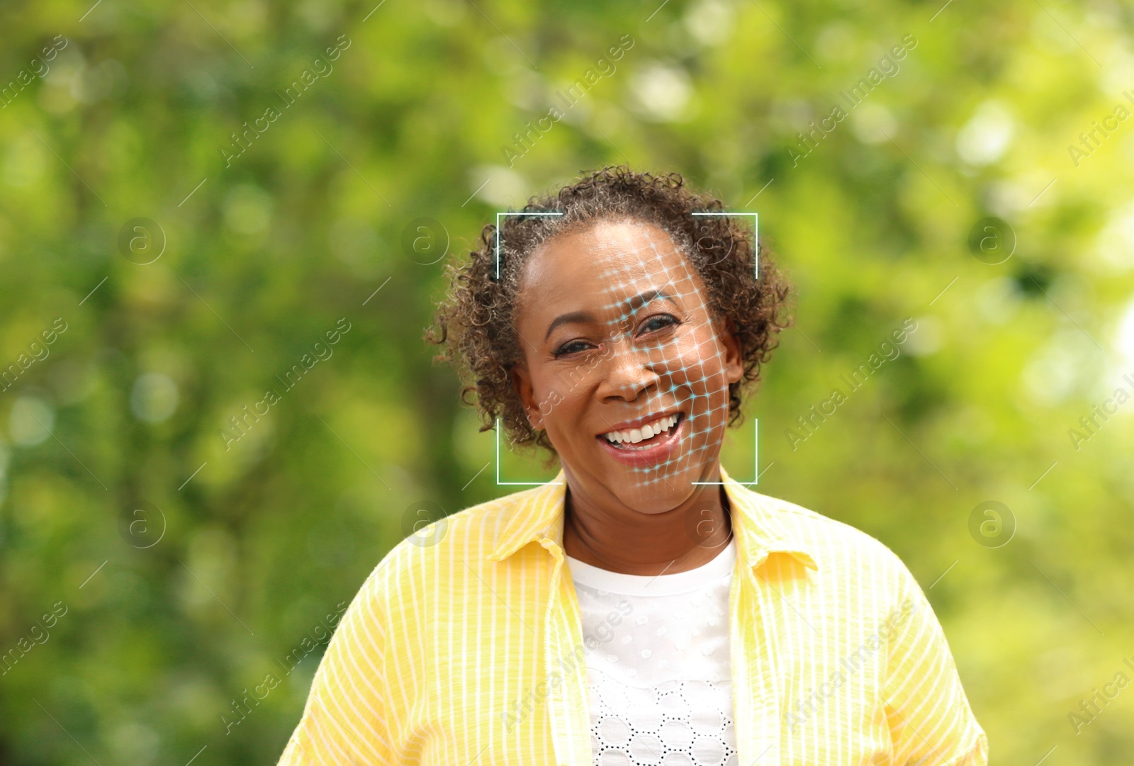 Facial recognition system. Scanning woman's face for authentication outdoors Image of Facial recognition system. Scanning woman's face for authentication outdoors