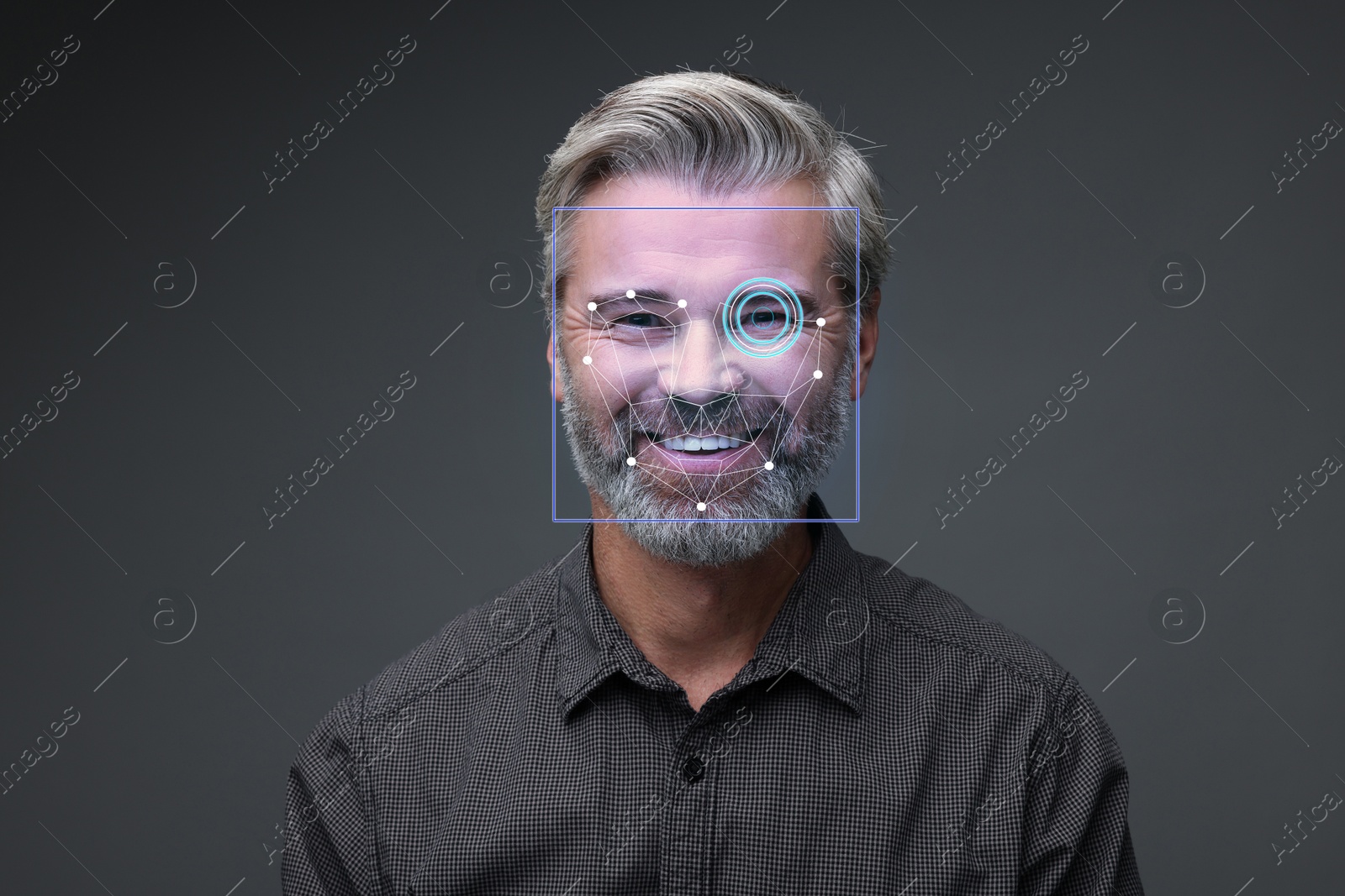 Facial recognition system. Scanning man's face for authentication against grey background Image of Facial recognition system. Scanning man's face for authentication against grey background