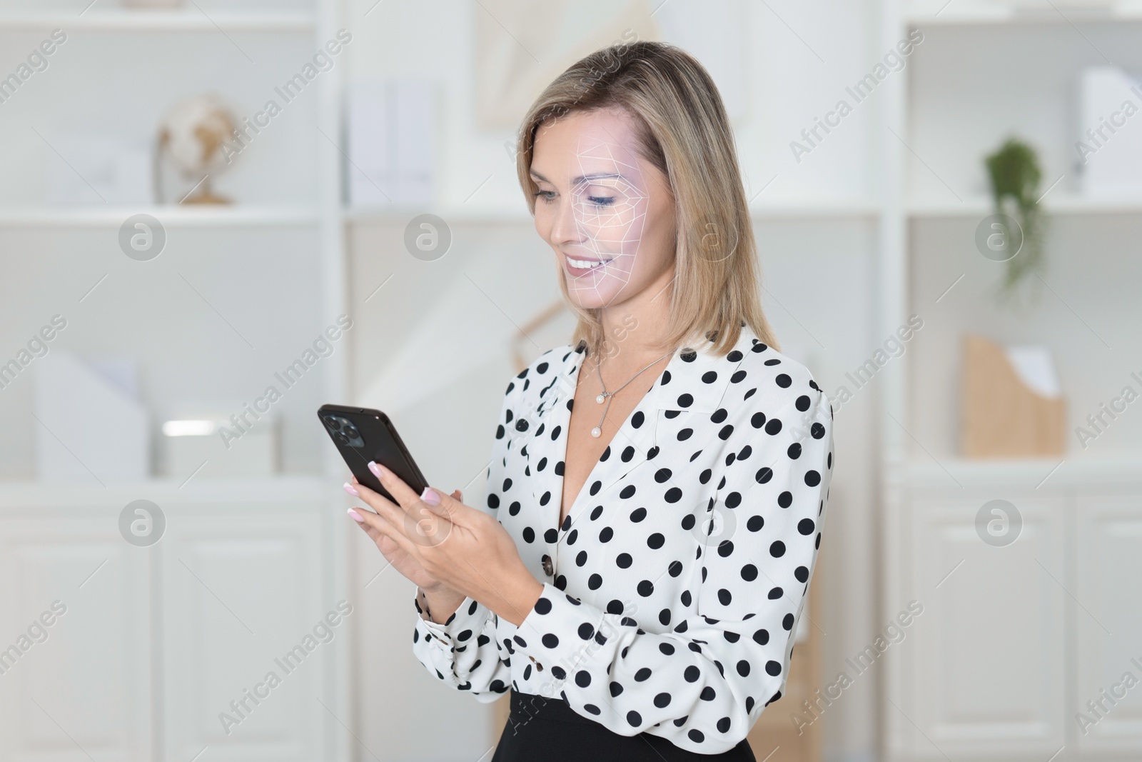 Woman unlocking her smartphone with facial recognition app at home. Biometric verification Image of Woman unlocking her smartphone with facial recognition app at home. Biometric verification