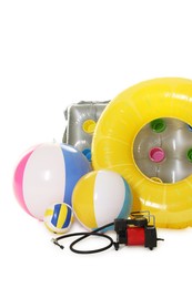 Photo of Inflatable ring, mattress, balls and air compressor isolated on white