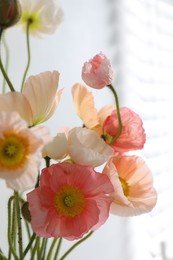 Photo of Bouquet of beautiful poppy flowers indoors, closeup