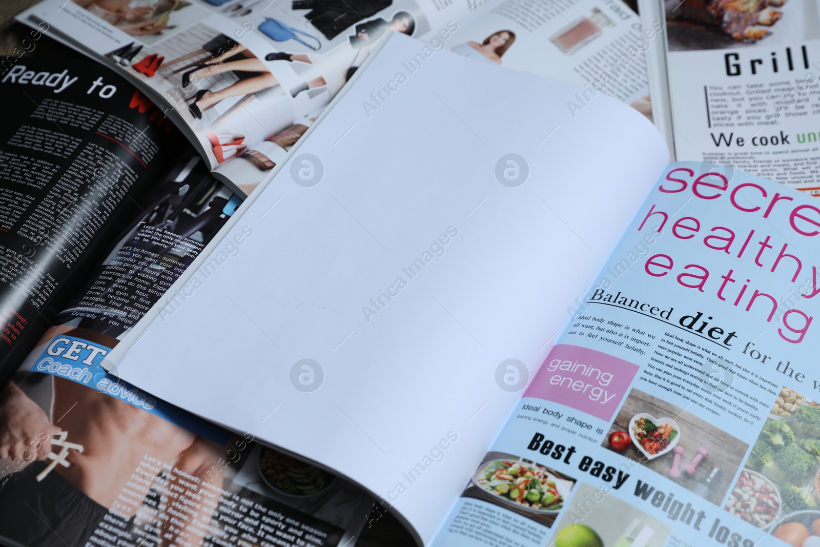 Photo of Different trendy magazines as background, closeup. Mockup for design