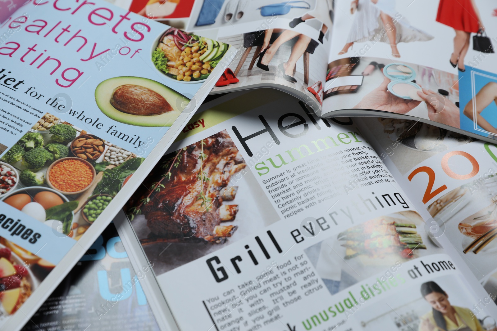 Photo of Many different trendy magazines as background, closeup