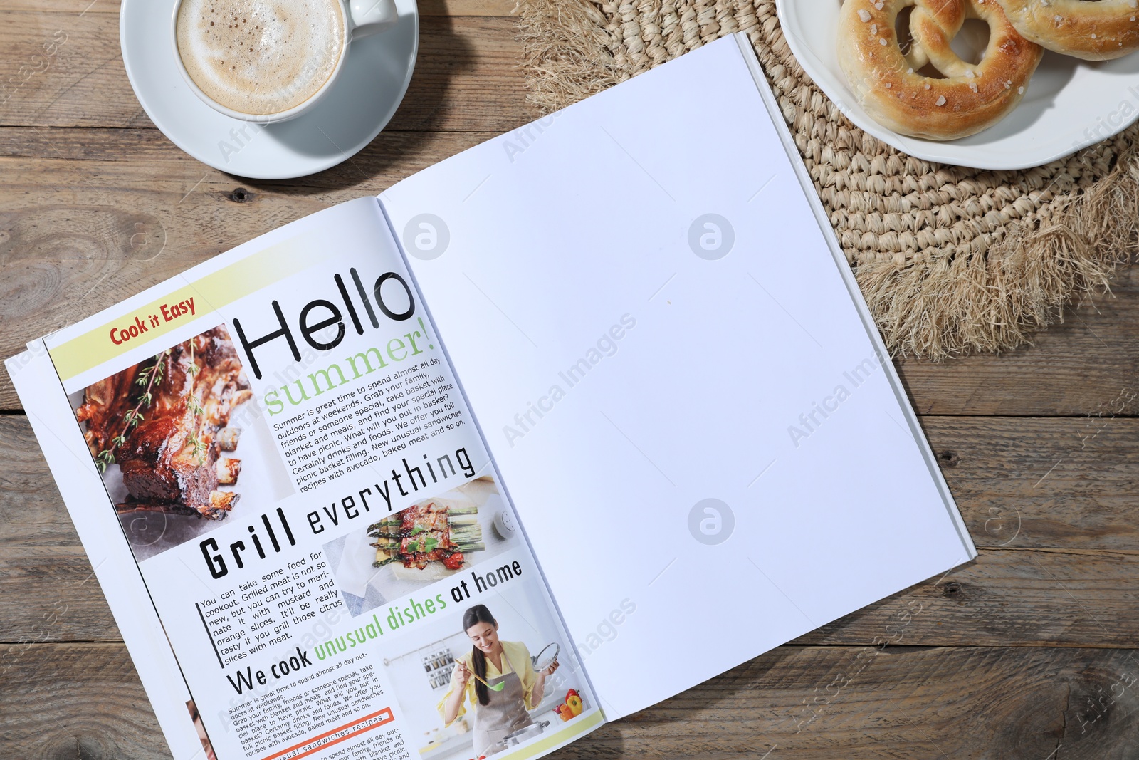 Open magazine, pretzels and coffee on wooden background, flat lay. Mockup for design Photo of Open magazine, pretzels and coffee on wooden background, flat lay. Mockup for design