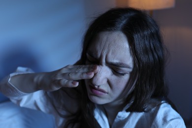 Photo of Frustrated woman suffering from insomnia at home