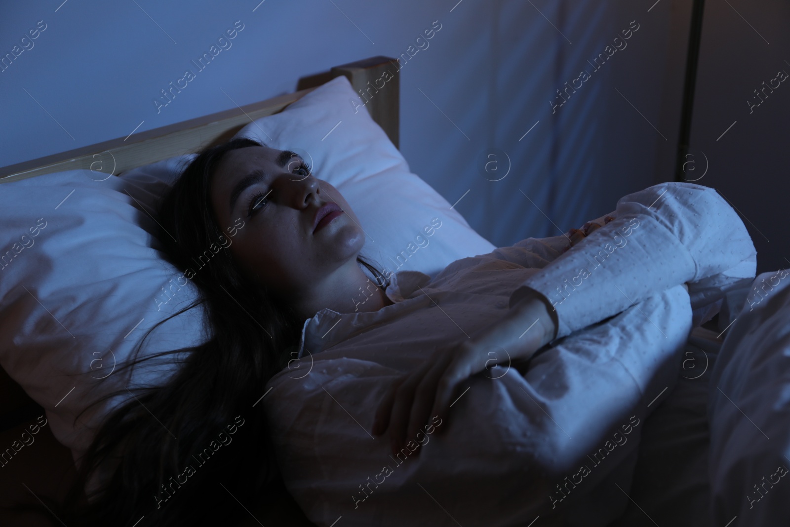 Frustrated woman suffering from insomnia in bed at home Photo of Frustrated woman suffering from insomnia in bed at home