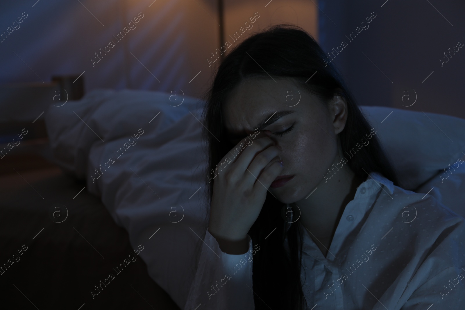 Frustrated woman suffering from insomnia at home, space for text Photo of Frustrated woman suffering from insomnia at home, space for text