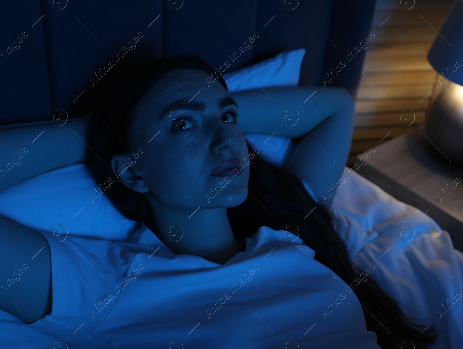 Frustrated woman suffering from insomnia in bed at home Photo of Frustrated woman suffering from insomnia in bed at home