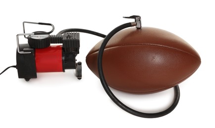 Photo of American football ball and air compressor isolated on white