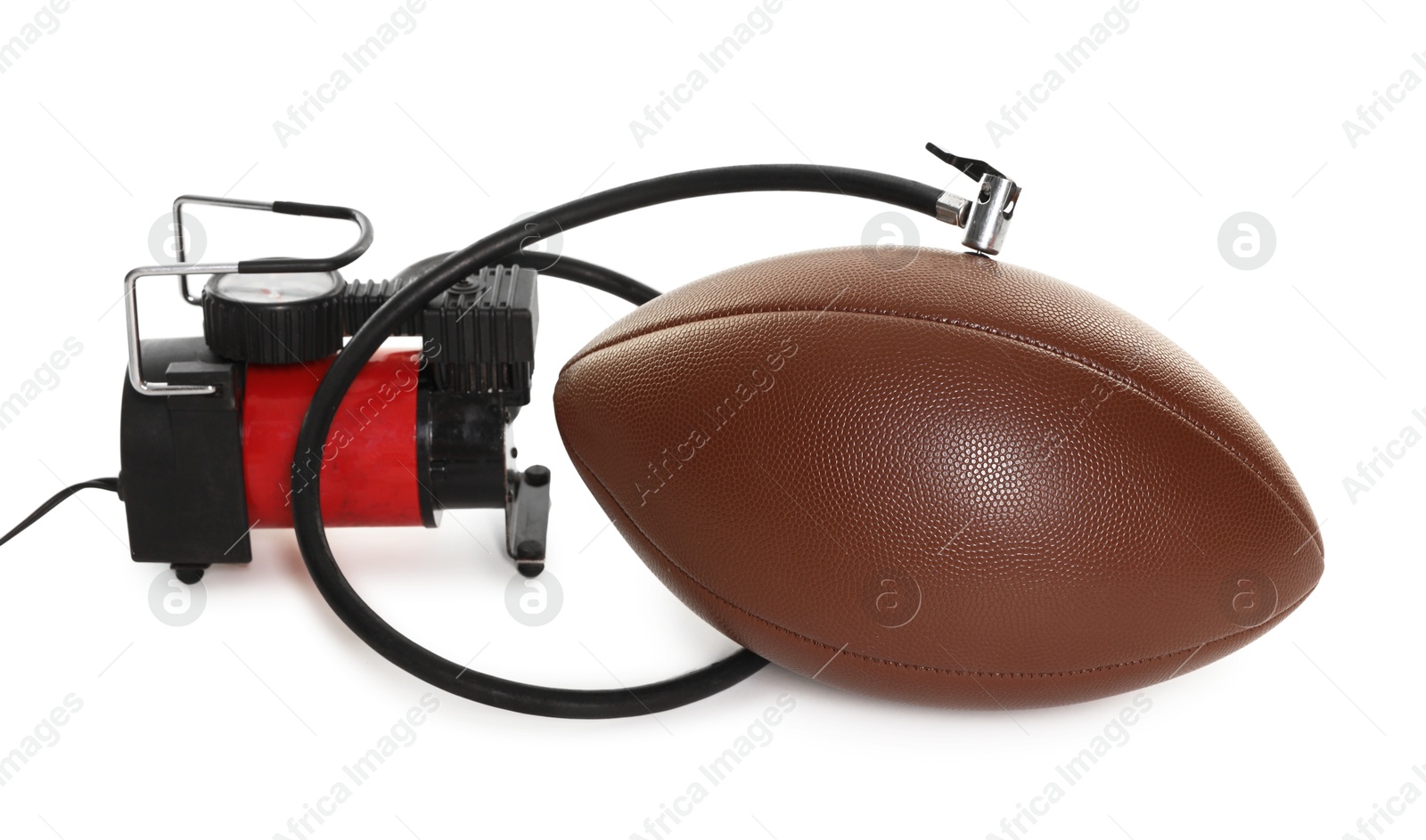 American football ball and air compressor isolated on white Photo of American football ball and air compressor isolated on white