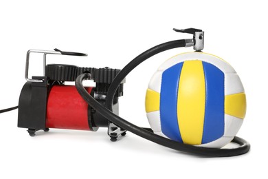 Photo of Volleyball ball and air compressor isolated on white