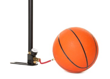 Photo of Basketball ball and manual air pump isolated on white