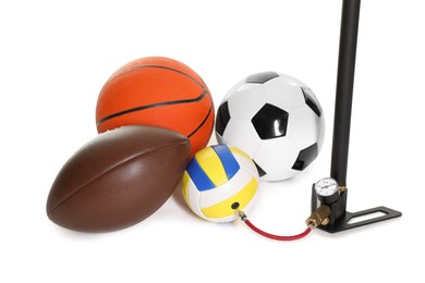 Photo of Different sport balls and manual air pump isolated on white