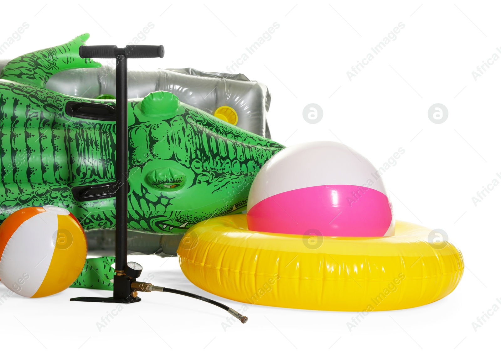 Inflatable ring, mattress, balls and manual air pump isolated on white Photo of Inflatable ring, mattress, balls and manual air pump isolated on white