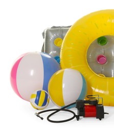 Photo of Inflatable ring, mattress, balls and air compressor isolated on white