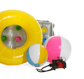 Photo of Inflatable ring, mattress, balls and air compressor isolated on white