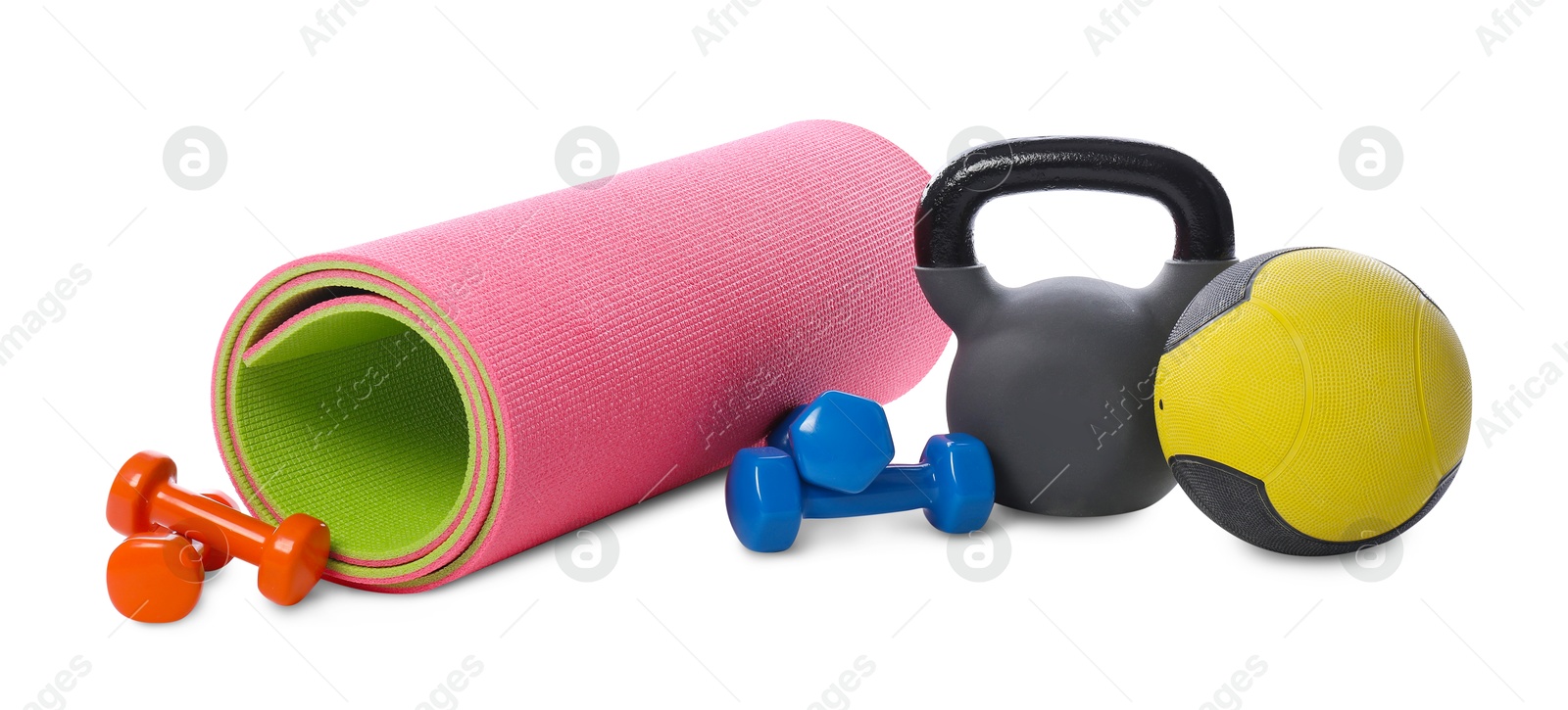 Medicine ball, dumbbells, kettlebell and fitness mat isolated on white Photo of Medicine ball, dumbbells, kettlebell and fitness mat isolated on white