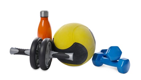 Photo of Medicine ball, dumbbells, ab wheel and water bottle isolated on white