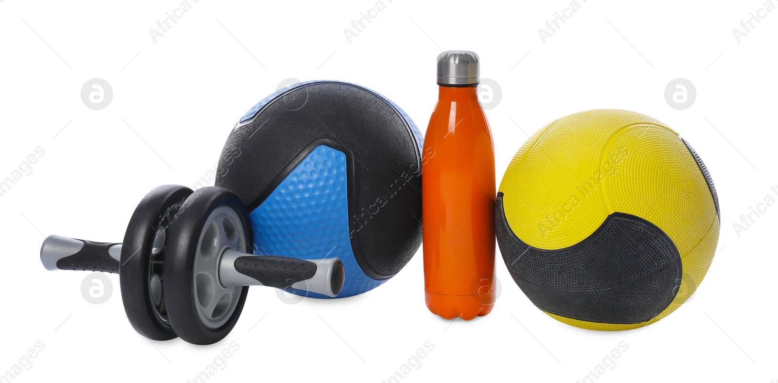 Medicine ball, dumbbells, ab wheel and water bottle isolated on white Photo of Medicine ball, dumbbells, ab wheel and water bottle isolated on white