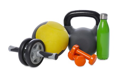 Photo of Medicine ball, dumbbells, kettlebell, water bottle and ab wheel isolated on white