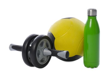 Photo of Medicine ball, water bottle and ab wheel isolated on white