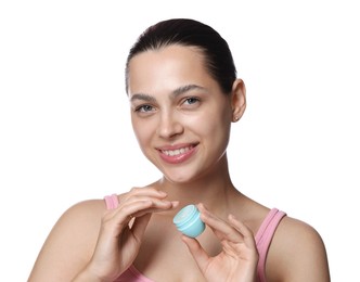 Photo of Young woman with lip balm on white background