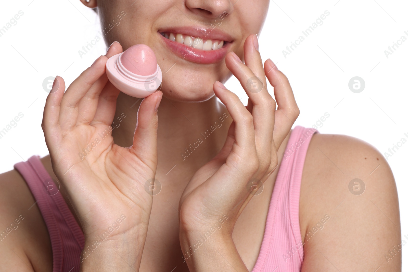 Young woman with lip balm on white background, closeup Photo of Young woman with lip balm on white background, closeup