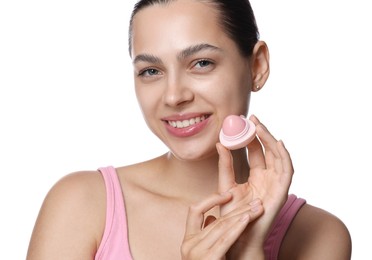 Photo of Young woman with lip balm on white background
