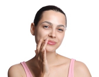 Photo of Young woman with lip balm on white background