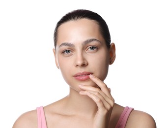 Photo of Young woman with lip balm on white background