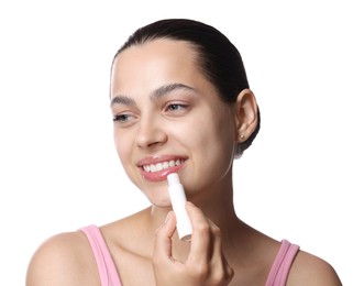 Photo of Young woman with lip balm on white background