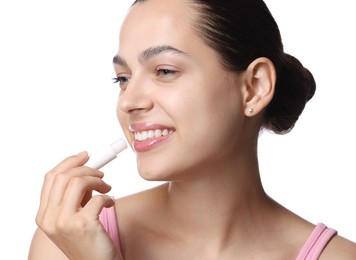 Photo of Young woman with lip balm on white background