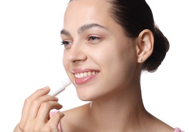 Photo of Young woman with lip balm on white background