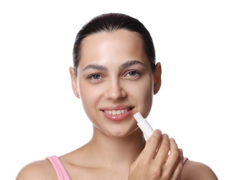 Photo of Young woman with lip balm on white background