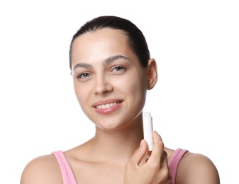 Photo of Young woman with lip balm on white background