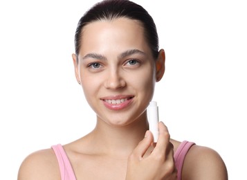 Photo of Young woman with lip balm on white background