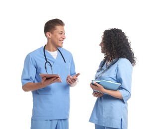 Photo of Medical students with tablet and books on white background