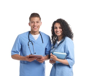Photo of Medical students with tablet and books on white background