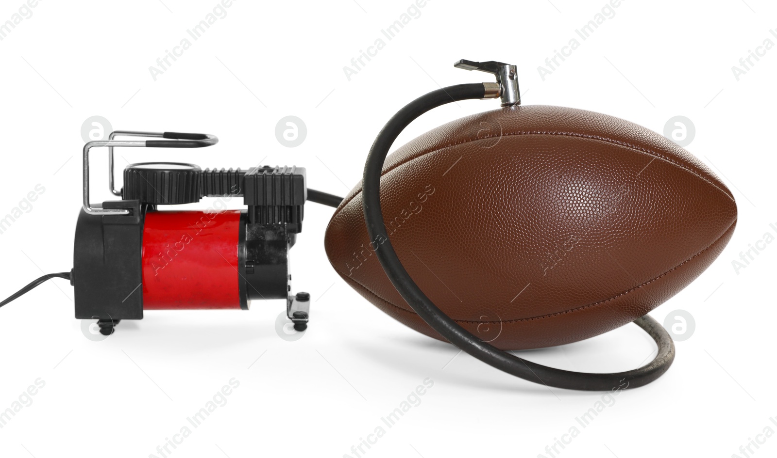 American football ball and air compressor isolated on white Photo of American football ball and air compressor isolated on white