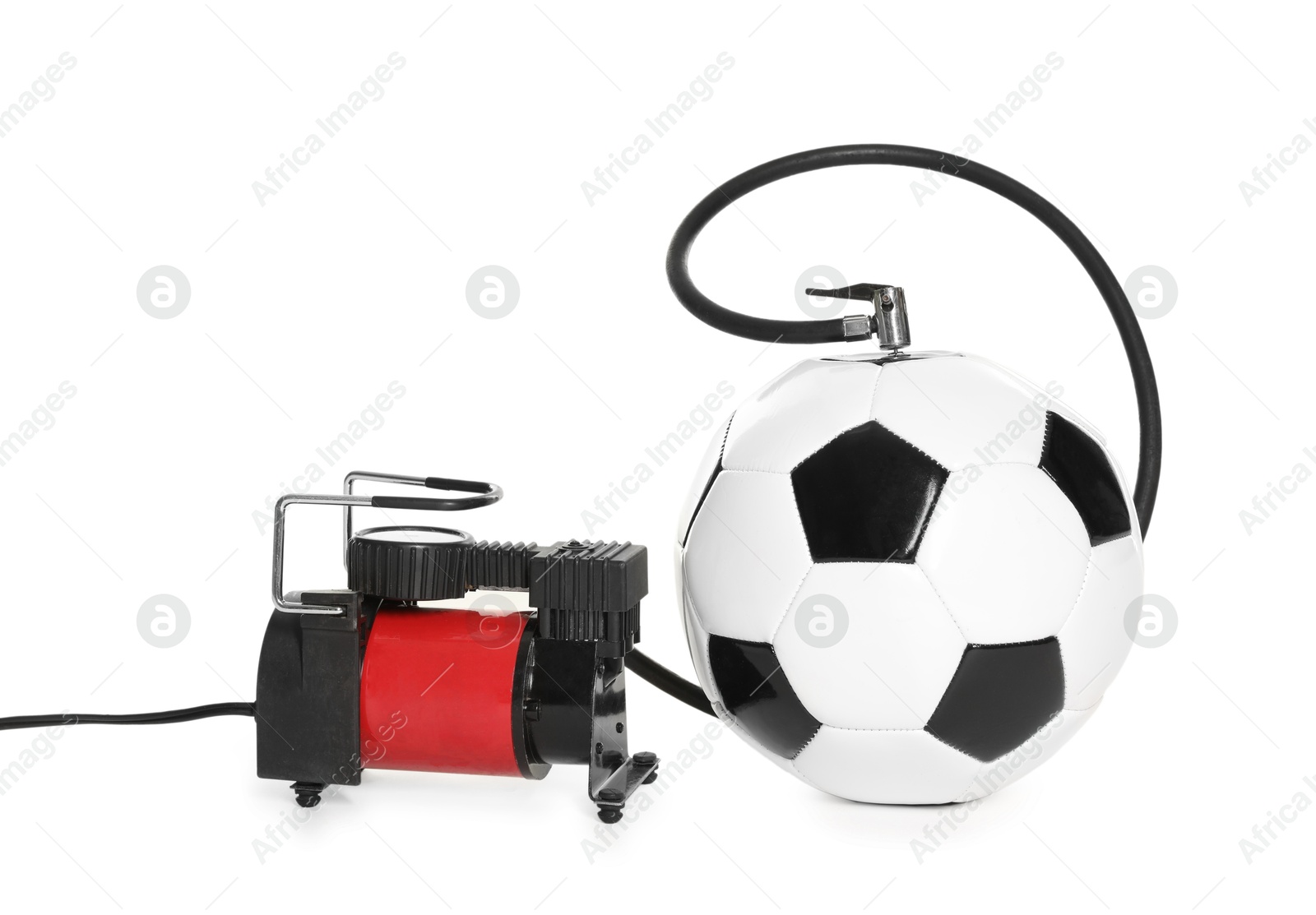 Soccer ball and air compressor isolated on white Photo of Soccer ball and air compressor isolated on white