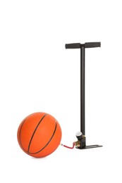 Photo of Basketball ball and manual air pump isolated on white
