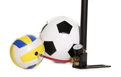 Photo of Different sport balls and manual air pump isolated on white